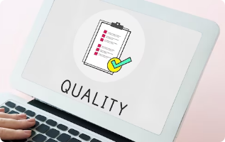 An image is displayed on a laptop screen that shows the word Quality.