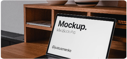 A laptop with Mockup written on it's wallpaper