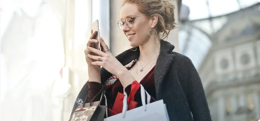 A digital marketing consultant using her phone