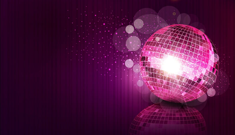 A disco ball on a vibrant purple background.